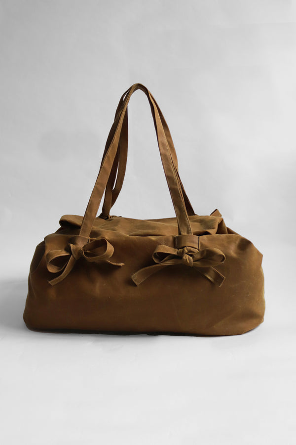 Brown waxed cotton handbag with bow details