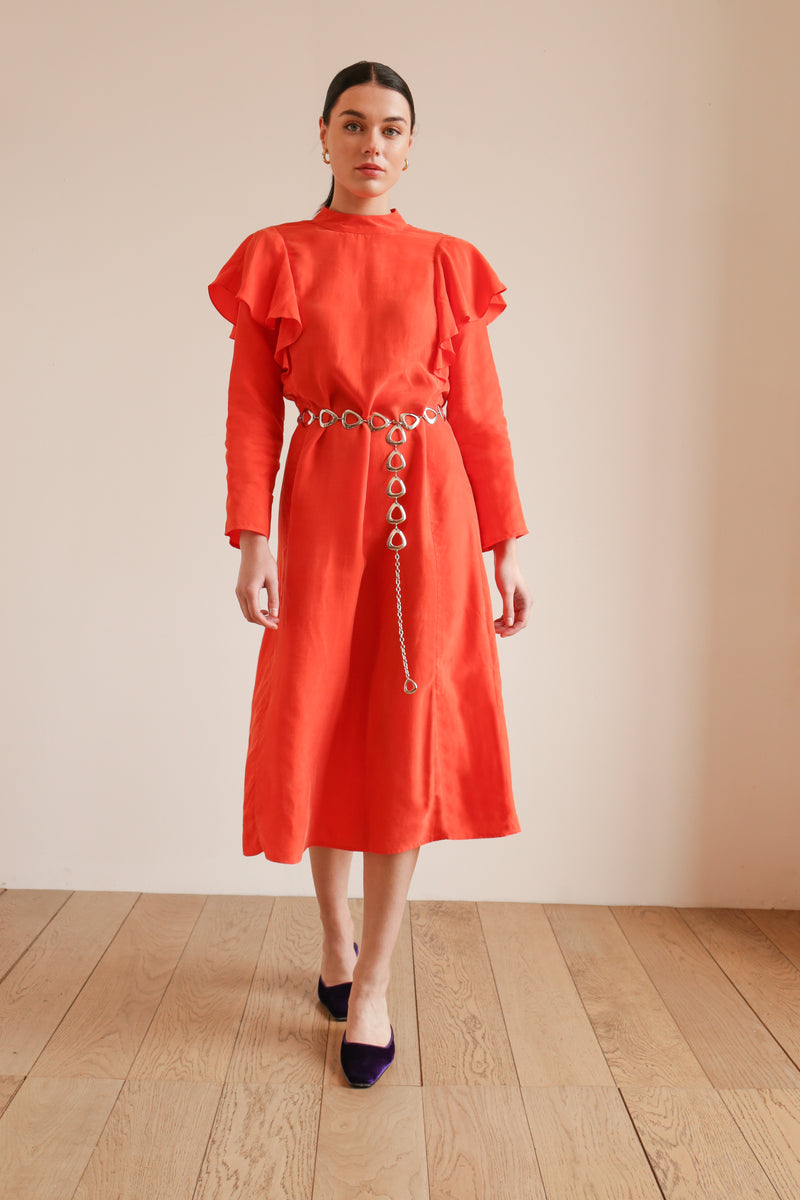 Model wears a deidei frida midi dress in orange 