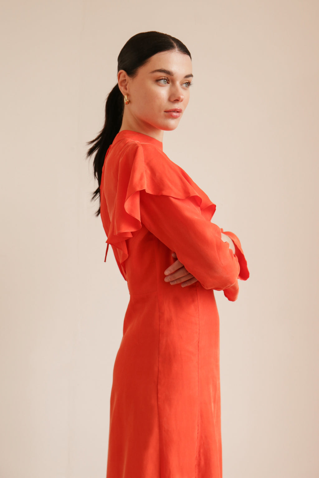 sustainable midi dress in orange cupro with cut out to the back